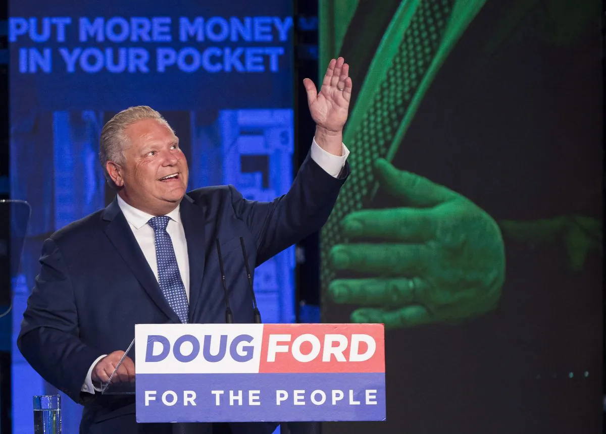 Ontario PC leader Doug Ford looks up and acknowledges his late brother Rob Ford after winning the Ontario Provincial election to become the new premier in Toronto on June 7, 2018. (The Canadian Press/Nathan Denette)
