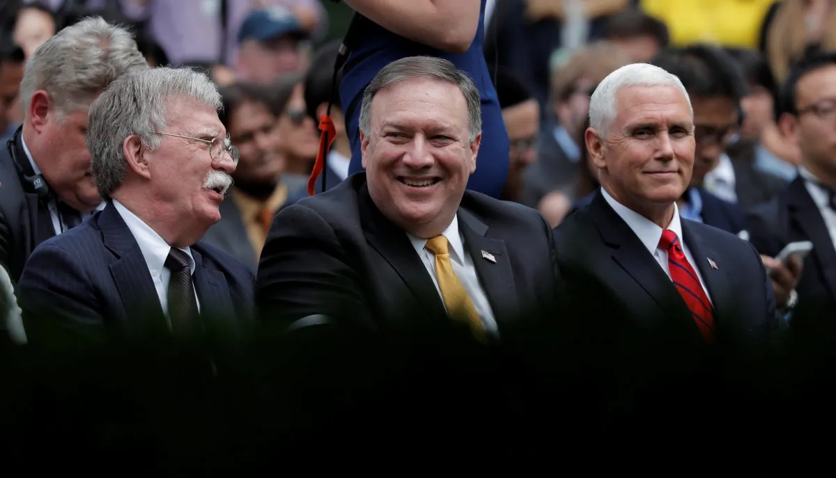 U.S. Secretary of State Mike Pompeo awaits the start of a joint news conference by U.S. President Donald Trump and Japan's Prime Minister Shinzo Abe as he sits between National Security Advisor John Bolton and Vice President Mike Pence in the Rose Garden of the White House in Washington, on June 7, 2018. (Reuters/Carlos Barria)