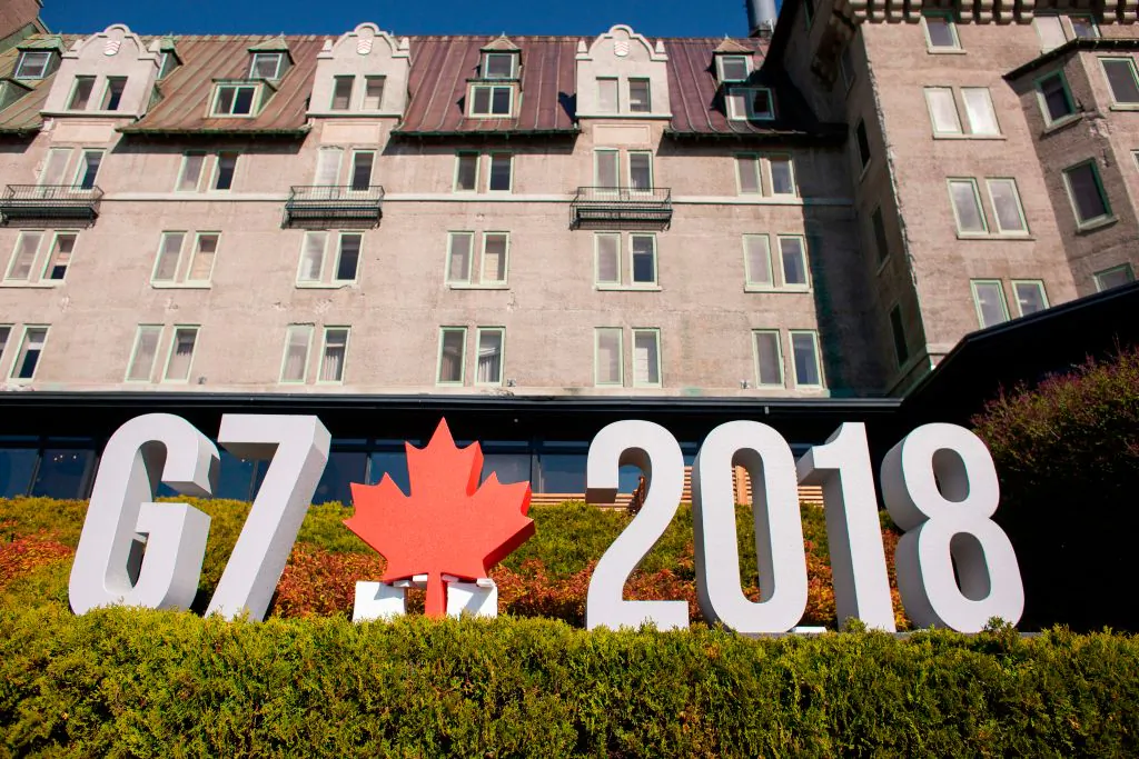 A sign sits in front of the Manoir Richelieu, the site of the G7 leaders summit in La Malbaie, Quebec, June 8. (GEOFF ROBINS/AFP/Getty Images)