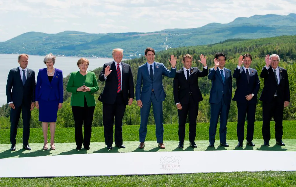 (L-R) The President of the European Council Donald Tusk, British Prime Minister Theresa May, German Chancellor Angela Merkel, U.S. President Donald Trump, Canadian Prime Minister Justin Trudeau, French President Emmanuel Macron, Japanese Prime Minister Shinzo Abe, Italian Prime Minister Giuseppe Conte, and the President of the European Commission Jean-Claude Juncker pose for a family photo during the G7 Summit in La Malbaie, Quebec, Canada, on June 8. (SAUL LOEB/AFP/Getty Images)