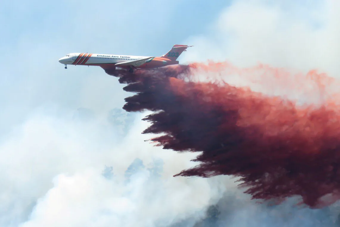 A plane drops fire-retardant chemicals on the 416 Fire near Durango, California, U.S. in this June 9, 2018. (La Plata County/Handout via Reuters)