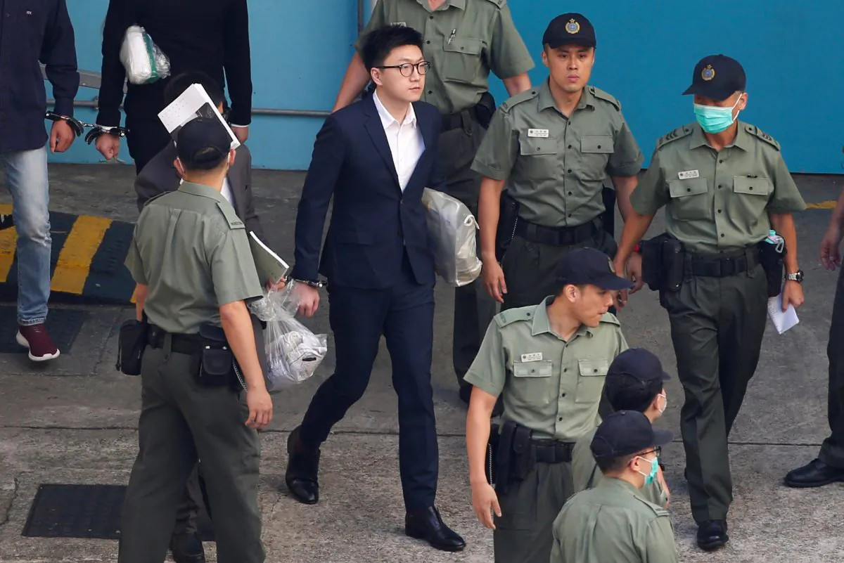 Pro-independence activist Edward Leung walks inside a detention centre before leaving for the High Court for a sentencing hearing in Hong Kong on June 11, 2018. (Bobby Yip/Reuters)