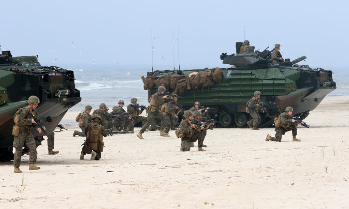 U.S. soldiers take part in a massive amphibious landing during the Exercise Baltic Operations (BALTOPS), a NATO maritime-focused military multinational exercise, on June 4, 2018 in Nemirseta on the Baltic Sea in Lithuania. (PETRAS MALUKAS/AFP/Getty Images)