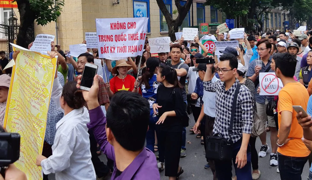Protesters during a demonstration against a draft legislation on special economic zone in Hanoi, Vietnam on June 10, 2018. Locals are concerned that the land could be leased to Chinese investors. (Staff/Reuters)