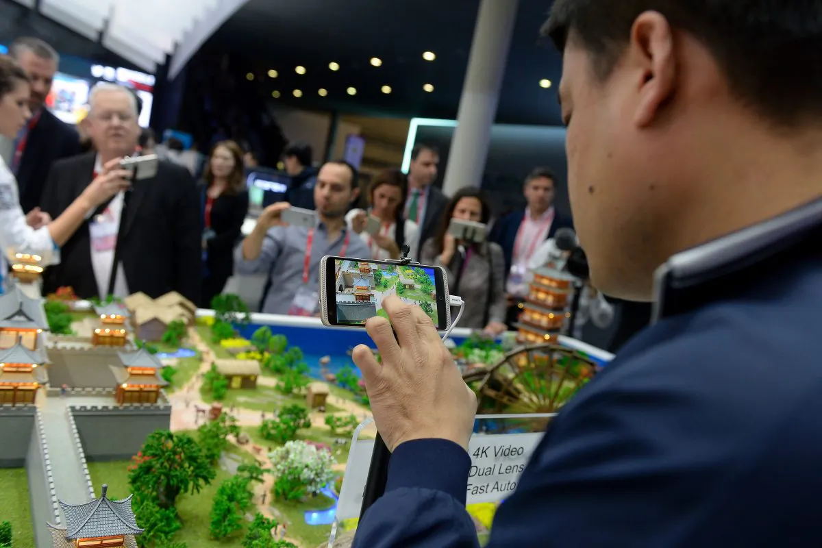Visitors test models of ZTE smartphones at the Mobile World Congress in Barcelona on Feb. 22, 2016. (JOSEP LAGO/AFP/Getty Images)