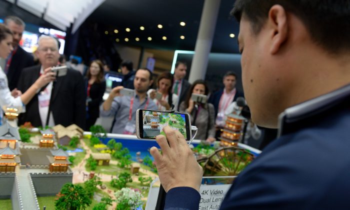 Visitors test models of ZTE smartphones at the Mobile World Congress in Barcelona on Feb. 22, 2016. (JOSEP LAGO/AFP/Getty Images)