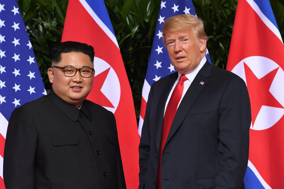 President Donald Trump (R) meets with North Korean  leader Kim Jong Un at the start of their historic summit, at the Capella Hotel on the island of Sentosa, Singapore, on June 12, 2018. (SAUL LOEB/AFP/Getty Images)