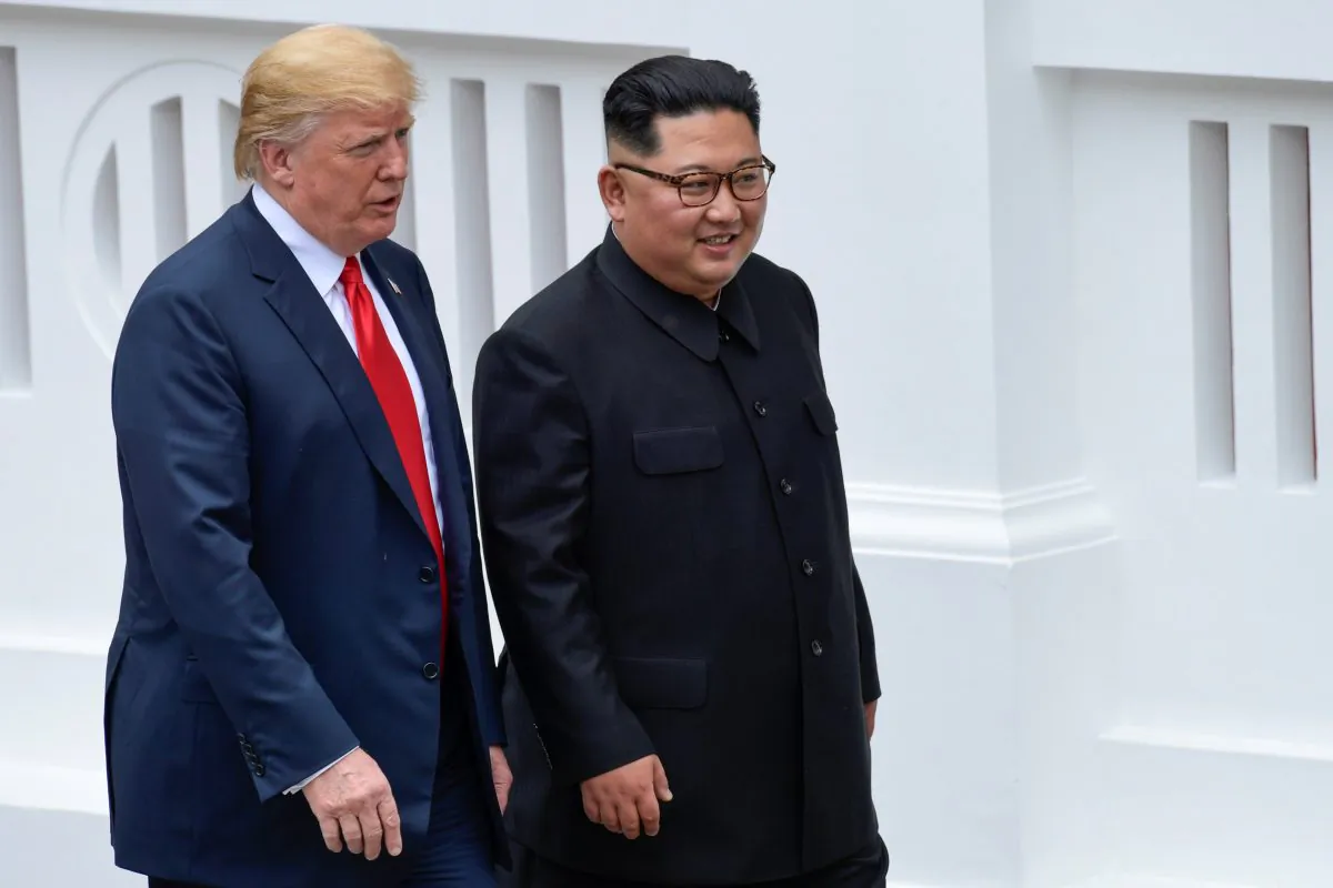 U.S. President Donald Trump and North Korean leader Kim Jong Un walk in the Capella Hotel after their working lunch, on Sentosa island in Singapore June 12, 2018. (Susan Walsh/Pool via Reuters)