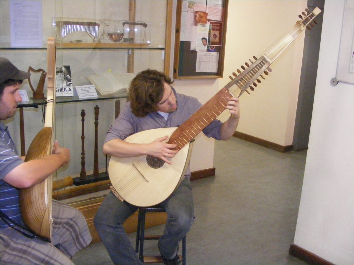 Musical instrument maker Alex Potter playing his reconstructed 17th- century ceterone, after his Masters degree in 2013. (Courtesy of Alex Potter)