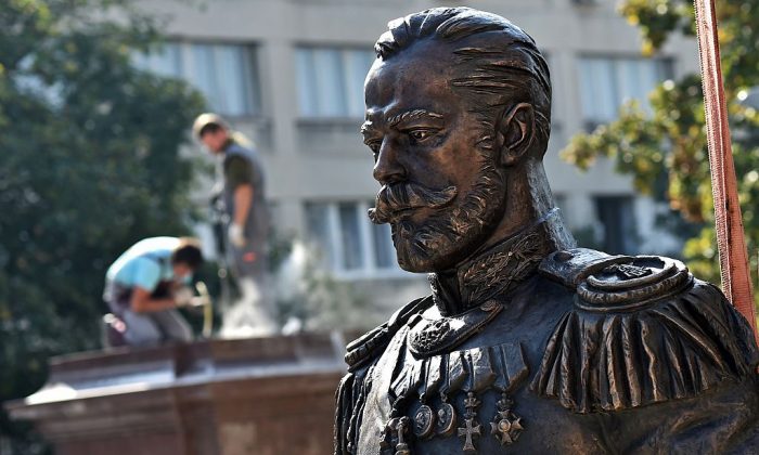 Workers prepare the plinth (L), where the monument of the last Russian Emperor, Czar Nicholas II, will be placed in Belgrade on October 13, 2014. While czarist rule over Russia ended in 1917, American administrations have continued to appoint unofficial administrative czars until this day. (ANDREJ ISAKOVIC/AFP/Getty Images)