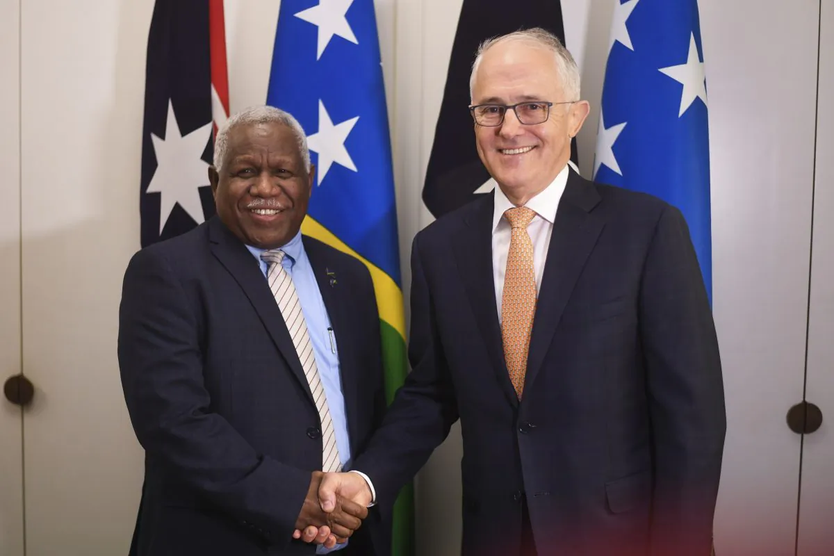 Prime Minister of the Solomon Islands Rick Houenipwela (L) and Australian Prime Minister Malcolm Turnbull shake hands ahead of a bilateral meeting at Parliament House in Canberra on June 13, 2018. (Lukas Coch/AFP/Getty Images)