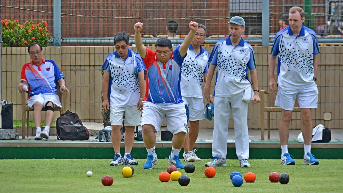 Kowloon Bowling Green Club bowler Musa Karamdin got excited with a great shot delivered by his skipper Ye Sui Ying (not in photo) at the Premier League Division 1 match last weekend, June 9. at the Hong Kong Football Club.   His joy was short lived as the KBGC team came out as the losing side after the final end. (Stephanie Worth)