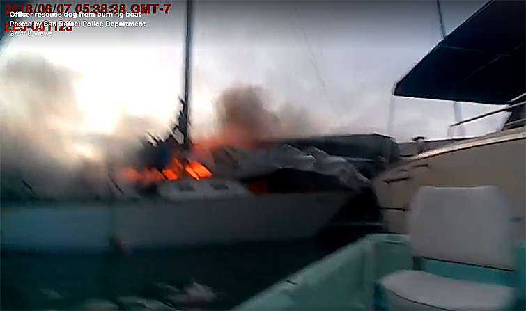 The video is fuzzy but the fire is very visible. What is not visible is the dog trapped on the burning boat. (San Rafael Police Department screenshot)