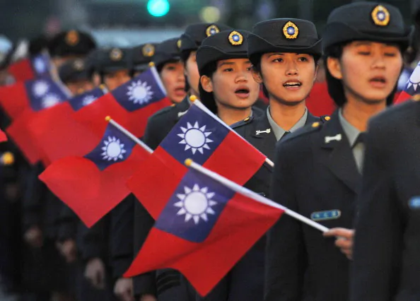 Students of a military school wave the Taiwan’s national flag during a ceremony at the Presidential Office Square in Taipei on January 1, 2013. (Mandy Cheng/AFP/Getty Images)
