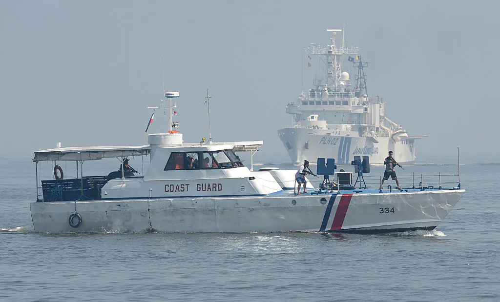 Philippine and Japanese coast guard personnel conduct joint anti-piracy exercises in the waters off Manila Bay on July 13, 2016.