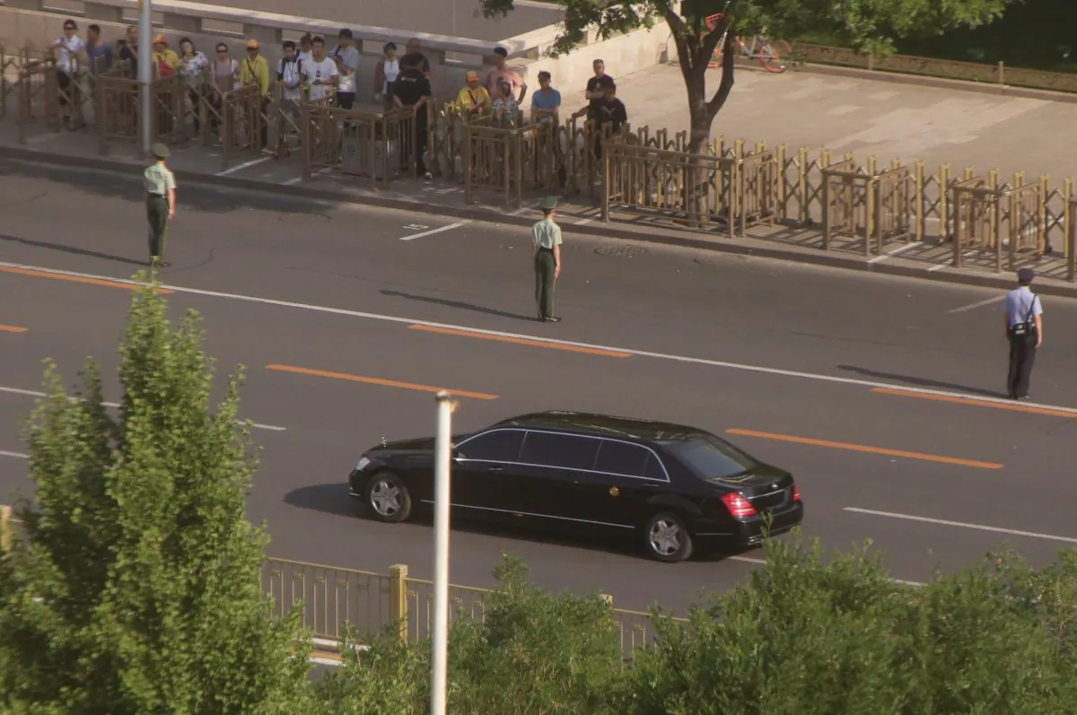 A vehicle of a motorcade believed to be carrying North Korean leader Kim Jong Un makes its way down Fuxingmennei Street in central Beijing, China, on June 19, 2018. (Jason Lee/Reuters) 