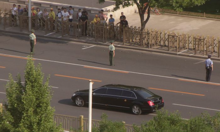 A vehicle of a motorcade believed to be carrying North Korean leader Kim Jong Un makes its way down Fuxingmennei Street in central Beijing, China, on June 19, 2018. (Jason Lee/Reuters) 