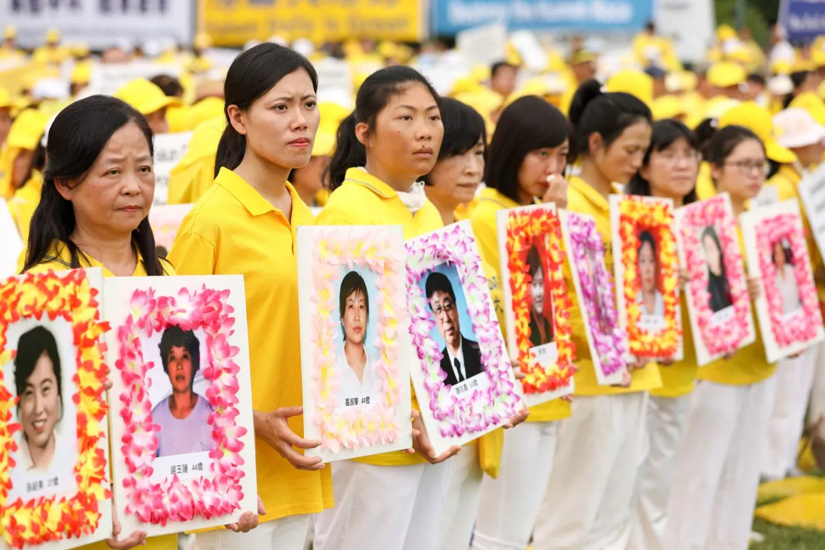 Falun Gong practitioners commemorate the deaths of adherents who were persecuted to death by the Chinese regime, during a march down Pennsylvania Ave. in Washington, D.C., on June 20, 2018. (Samira Bouaou/The Epoch Times)
