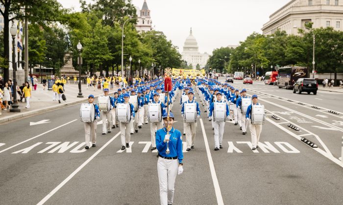 The Tian Guo Marching Band heads down Pennsylvania Ave. in Washington on June 20, 2018. Tian Guo means “celestial.” (Edward Dye/Epoch Times)
