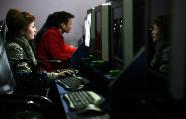 People surf the internet at a cyber cafe in Chongqing, a megacity in southwestern China, on Jan. 24, 2007. (China Photos/Getty Images)