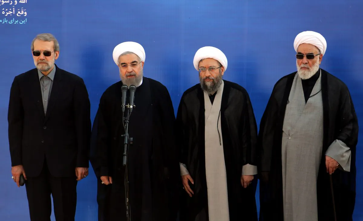 Iranian President Hassan Rouhani (2nd-L) at Tehran Mehrabad International Airport on Oct. 3, 2015. Large-scale protests in Iran are now calling for an end to the regime. (Atta Kenare/AFP/Getty Images)