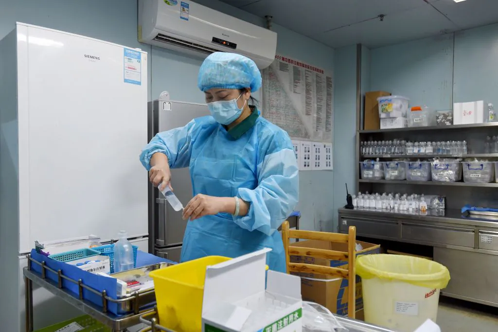 A nurse prepares medicine for a bird flu patient in a hospital in Wuhan, the capital of central China’s Hubei Province on Feb. 12, 2017. (STR/AFP/Getty Images)