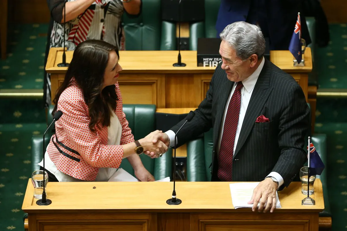 New Zealand Prime Minister Jacinda Ardern (L) shakes hands with Deputy Prime Minister Winston Peters after her speech during the 2018 budget presentation at Parliament on May 17, 2018 in Wellington, New Zealand. (Hagen Hopkins/Getty Images)