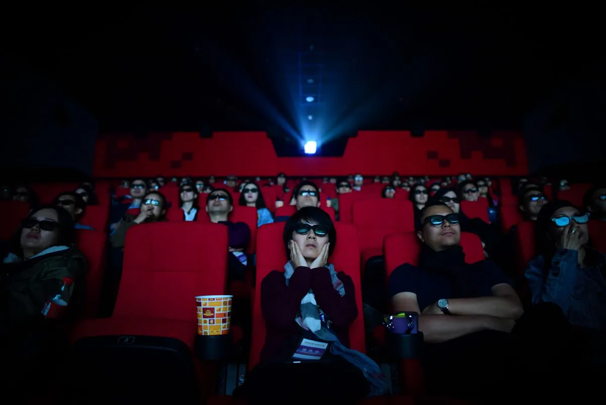 This file photo shows people watching a movie at the Wanda Group's Oriental Movie Metropolis movie theater in Qingdao City, Shandong Province on April 27, 2018. (Wang Zhao/AFP/Getty Images)