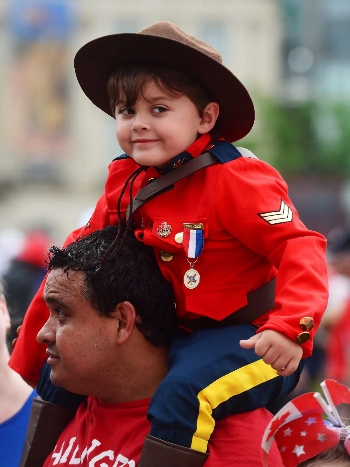 A youngster dressed like a Mountie takes part in the Canada Day celebrations on Parliament Hill on July 1, 2017. (The Canadian Press/Sean Kilpatrick)