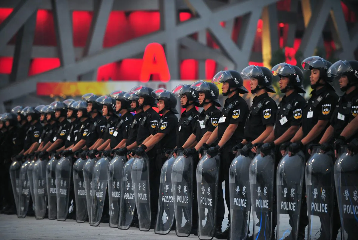 Members of a police SWAT team line up outside the main Beijing Olympic Stadium during security drill rehearsals on July 23, 2008. (Frederic J. Brown/AFP/Getty Images)