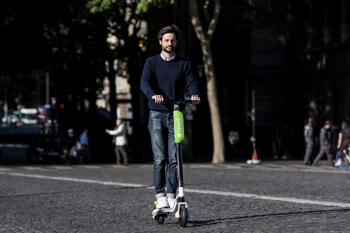 Arthur-Louis Jacquier, director General of Lime France, rides an electric scooter on their launch day in Paris on June 22. (CHRISTOPHE ARCHAMBAULT/AFP/Getty Images)