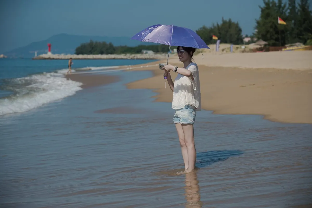 A woman enjoys the beach at the Club med resort in Sanya, Hainan Province, China, in this file photo. (Nicolas Asfouri/AFP/Getty Images)