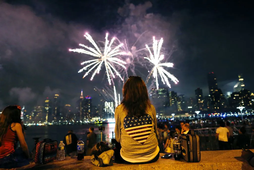 People watch the annual Macy's 4th of July fireworks show from the Queens borough of New York on July 4, 2017. (Eduardo Munoz Alvarez/AFP/Getty Images)