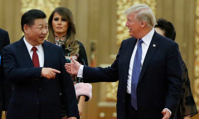 U.S. President Donald Trump and Chinese leader Xi Jinping arrive at a state dinner at the Great Hall of the People in Beijing on November 9, 2017. (Thomas Peter/Getty Images)