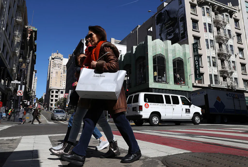 A shopper carries a shopping bag while walking in the Union Square district in San Francisco, California, on February 27. The U.S. consumer confidence index surged to 130.80 in February, its highest level since November 2000. (Justin Sullivan/Getty Images)