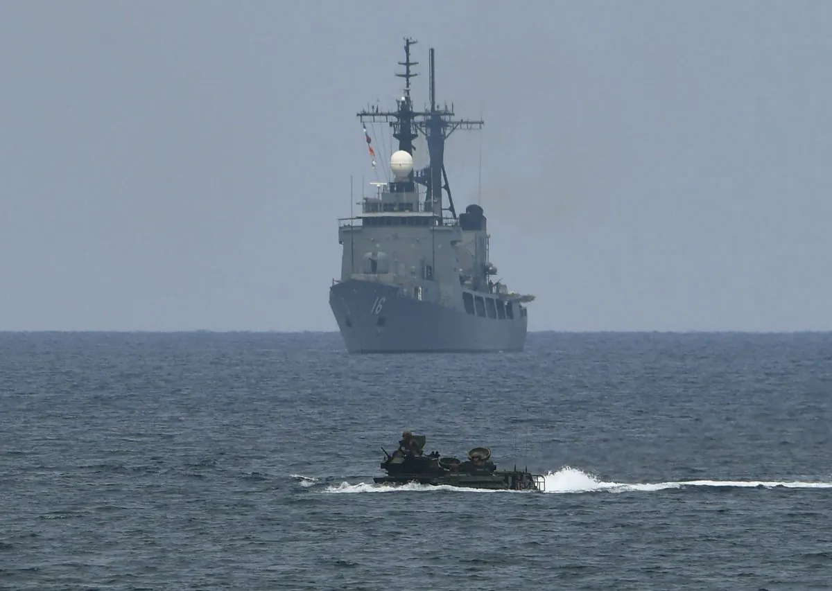 A U.S. assault amphibious vehicle with a Philippine navy frigate, Ramon Alcaraz, during annual Philippines and US joint military exercises in the South China Sea on May 9, 2018. (Ted Aljibe/AFP/Getty Images)