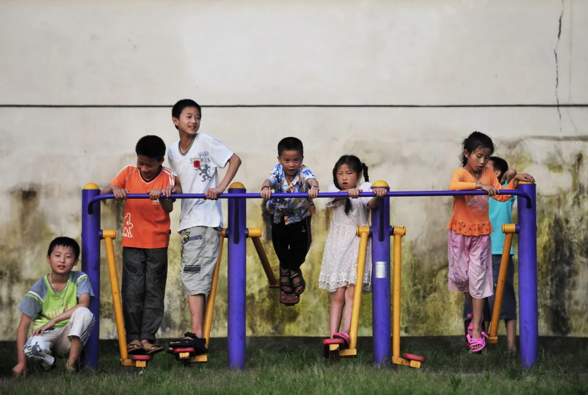 Children play in a university campus in Fuzhou City, Jiangxi Province, China, on June 27, 2010. (STR/AFP/Getty Images)