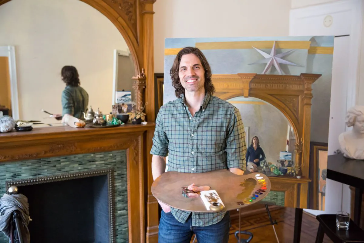 Painter, draftsman, and teacher M.Tobias Hall paints in his apartment in New York on April 27, 2018. (Milene Fernandez/The Epoch Times)