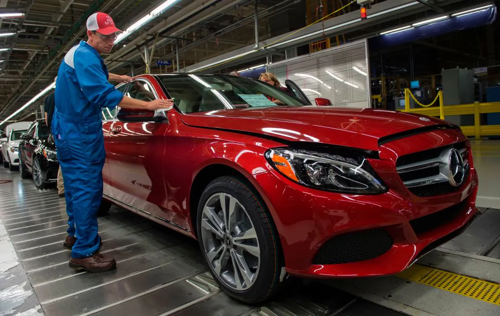 An employee does final inspections on a Mercedes-Benz C-Class at the Mercedes-Benz US International factory in Vance, Alabama on June 8, 2017. (ANDREW CABALLERO-REYNOLDS/AFP/Getty Images)