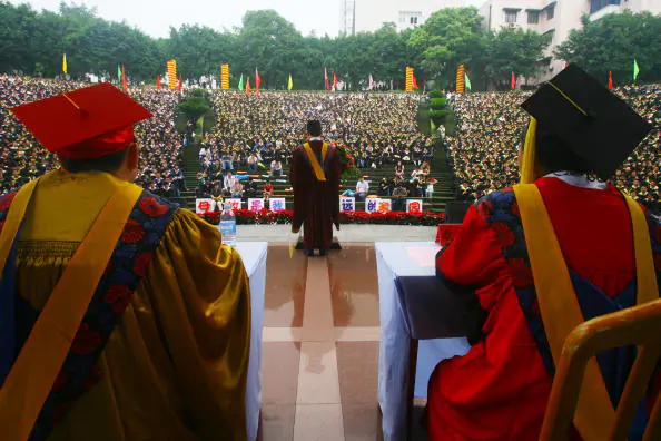 Bachelor graduates attend a graduation ceremony at the Chongqing University in Chongqing on June 22, 2007. (China Photos/Getty Images)
