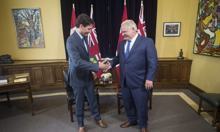 Ontario Premier Doug Ford and Canadian Prime Minister Justin Trudeau pose for a photo at the Ontario Legislature, in Toronto on Thursday, July 5, 2018. (The Canadian Press/Chris Young)