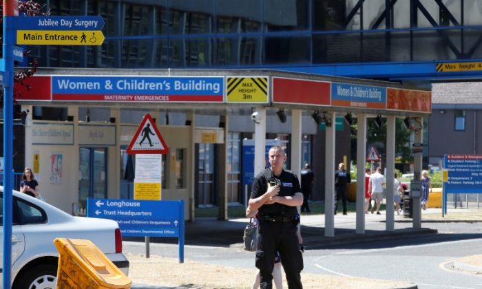 A security officer outside the entrance to the Countess of Chester Hospital, Chester, Britain, July 3, 2018. (Andrew Yates/Reuters)