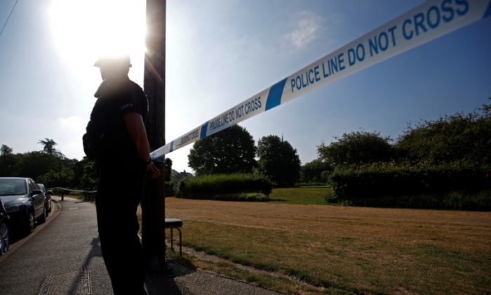 A police officer guards a cordoned off area after it was confirmed that two people had been poisoned with the nerve-agent Novichok, in Salisbury, Britain, July 5, 2018. (Henry Nicholls/Reuters)