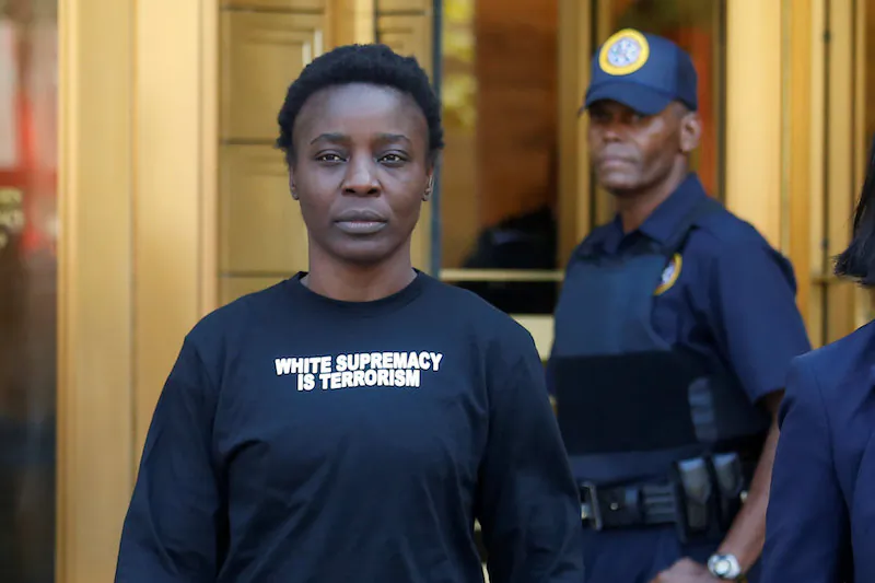 Patricia Okoumou walks out of federal court from her arraignment, a day after authorities say she scaled the stone pedestal of the Statue of Liberty, in Manhattan, New York, on July 5, 2018. (REUTERS/Shannon Stapleton)