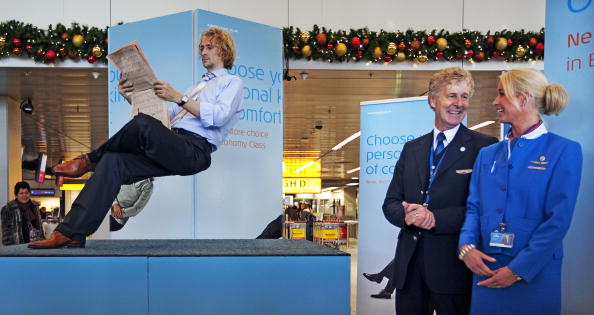 Dutch Illusionist Ramana shows (L) during a performance at Amsterdam Schiphol Airport the space for passengers of the new Economy Comfort class, on Dec. 7, 2009.  (Getty Images)