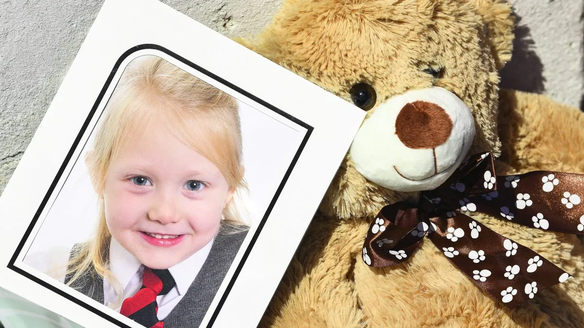 A school picture of Alesha MacPhail is left at a house in Rothesay, Isle of Bute, Scotland, on July 4, 2018. (Jeff J Mitchell/Getty Images)