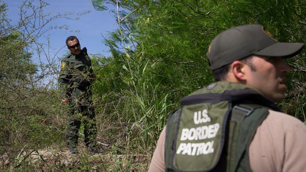 Border Patrol agents search the Rio Grande River for illegal immigrants crossing the border from Mexico into the United States on Monday, March 26, 2018 near McAllen, Texas. (Loren Elliott/AFP/Getty Images)
