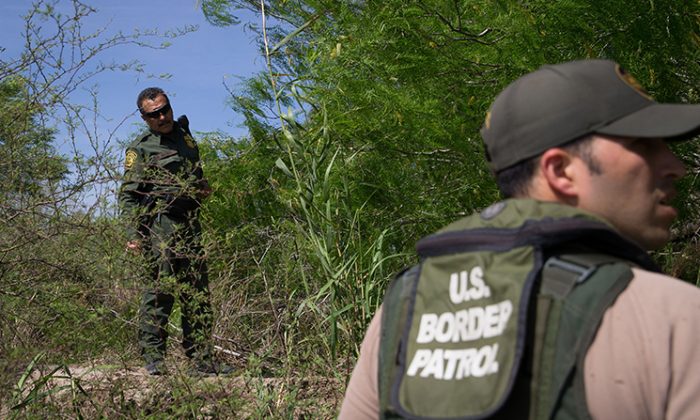 Border Patrol agents search the Rio Grande River for illegal immigrants crossing the border from Mexico into the United States on Monday, March 26, 2018 near McAllen, Texas. (Loren Elliott/AFP/Getty Images)