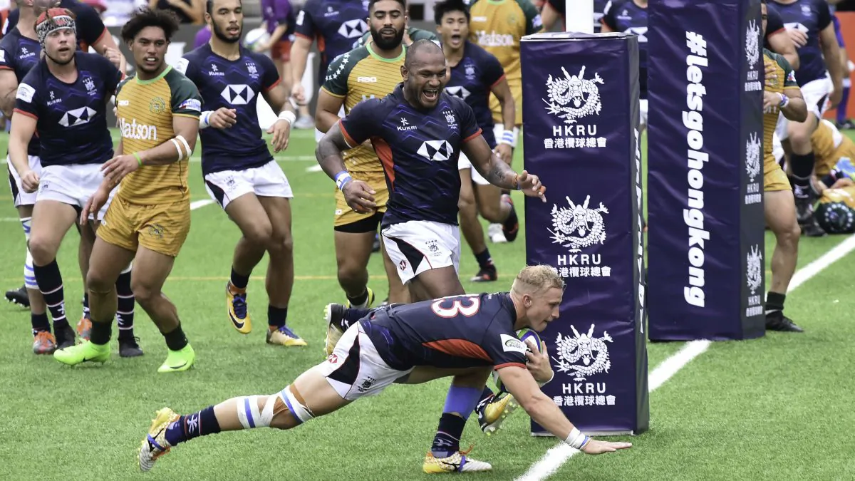 Max Woodward scores for Hong Kong to take the score to 17-0 after a successful conversion by Matthew Rosslee in the Asia/Oceana playoff match against the Cook Islands in Hong Kong on Saturday July 7, 2018. (Bill Cox/Epoch Times)