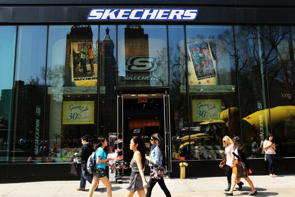 People walk by a Skechers store on April 10, 2013, in New York City.(Spencer Platt/Getty Images)